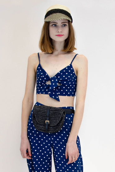 Black Straw Fanny Pack around woman's waist