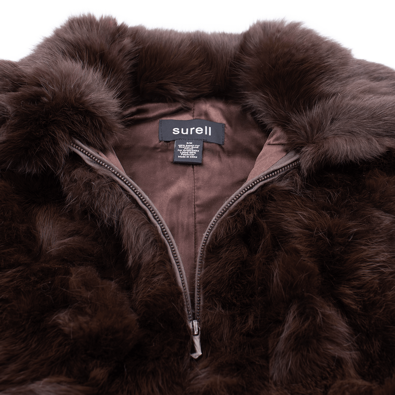 Close up of zipper on brown rabbit fur vest