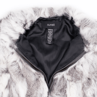 White and gray rabbit fur vest unzipped halfway