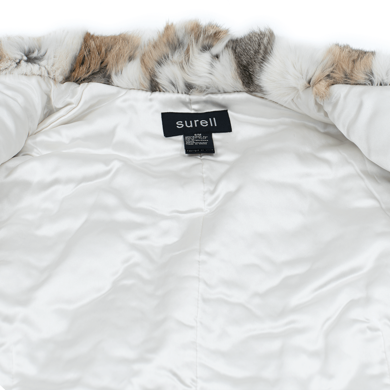White lining on white and light brown rabbit fur vest